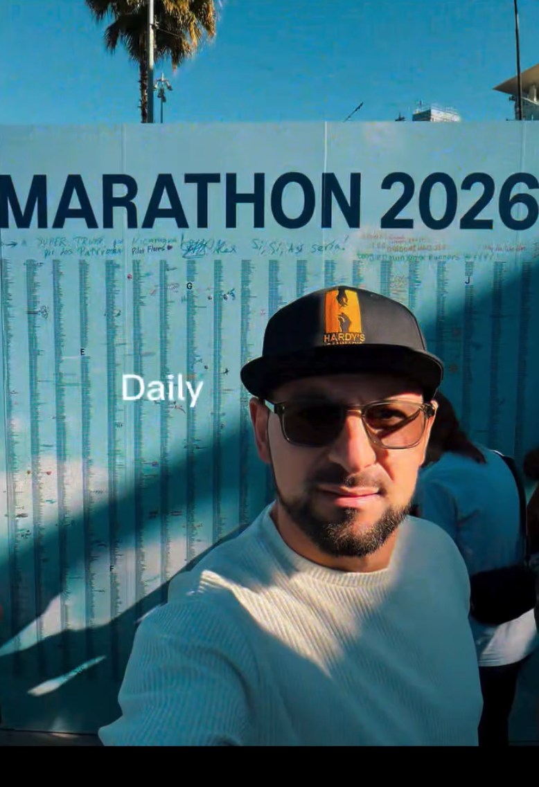 Chris Hardy in front of the marathon 2026 runners wall